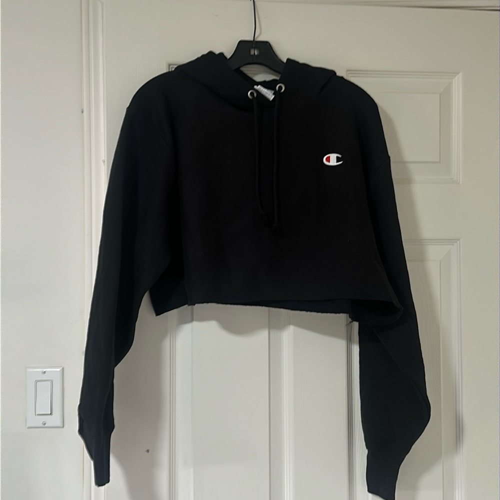 Black champion sweatshirt with hood. Size small. Never worn brand new.